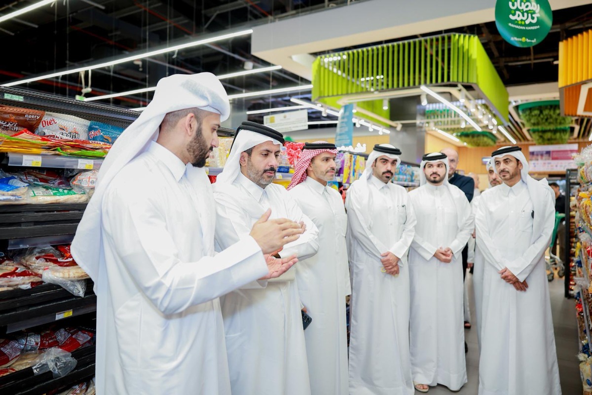 Minister of Commerce and Industry H E Sheikh Faisal bin Thani bin Faisal Al-Thani along with other officials during a visit at a retail outlet.