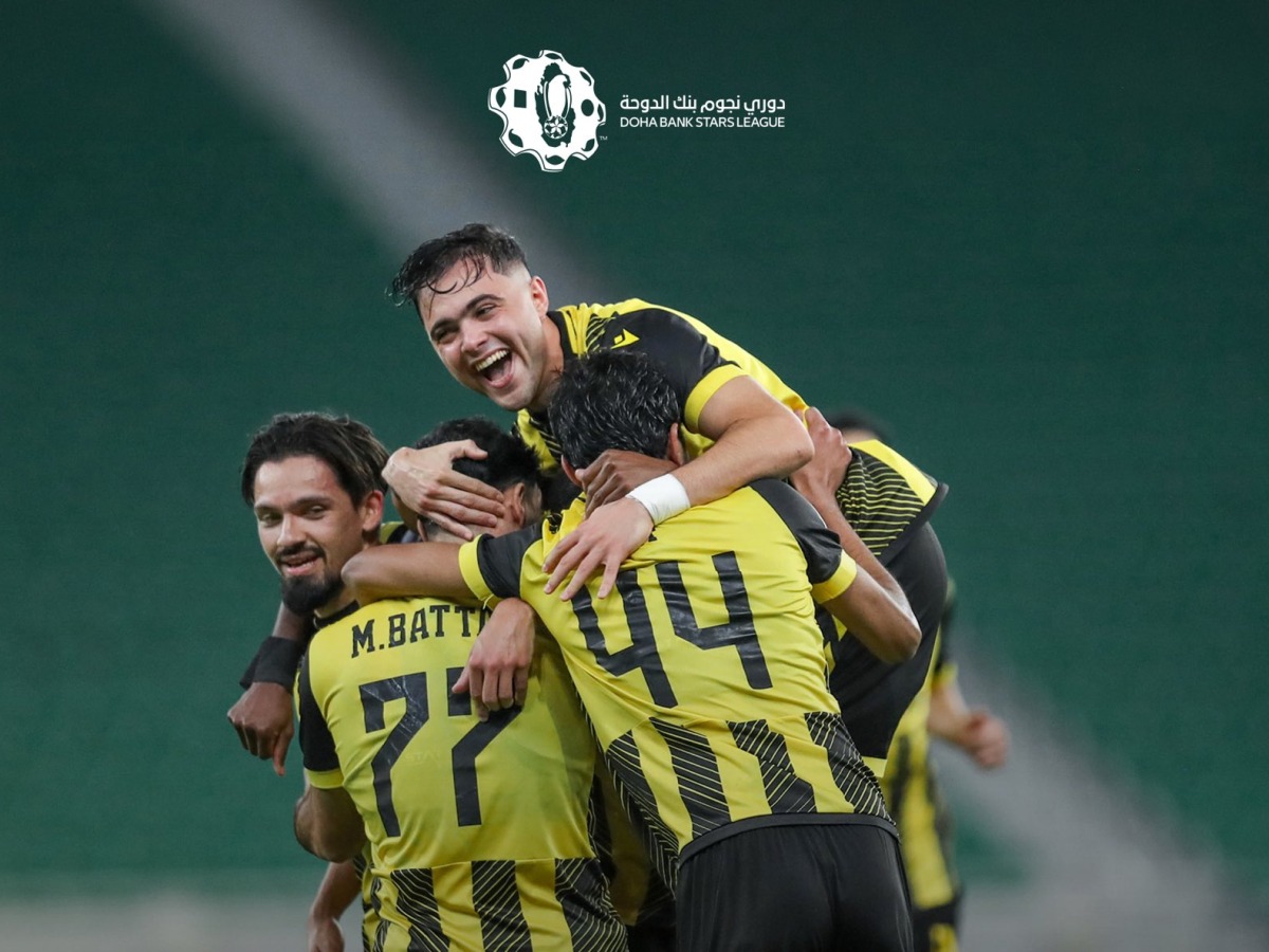 Qatar SC's Mus’ab Al Battat celebrates with teammates. 
