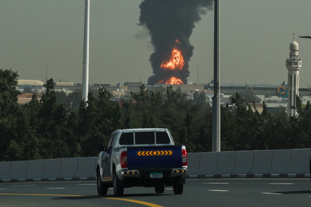 A smoke plume rise from an ongoing fire at Dubai International Airport in Dubai on March 16, 2026. (All photos by AFP)