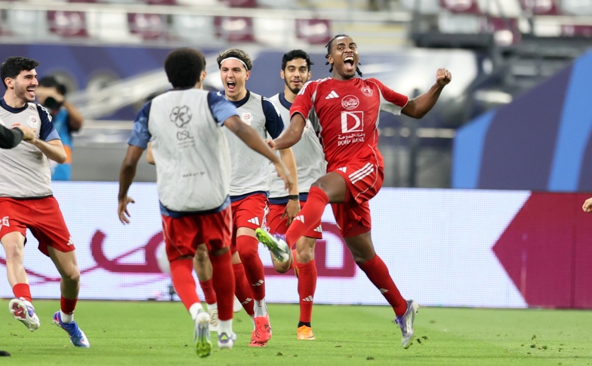 Al Arabi's Isaac Lihadji (right) celebrates with teammates.