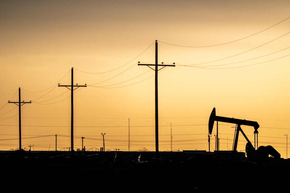 A pump jack is seen at sunset in Midland, Texas, US.