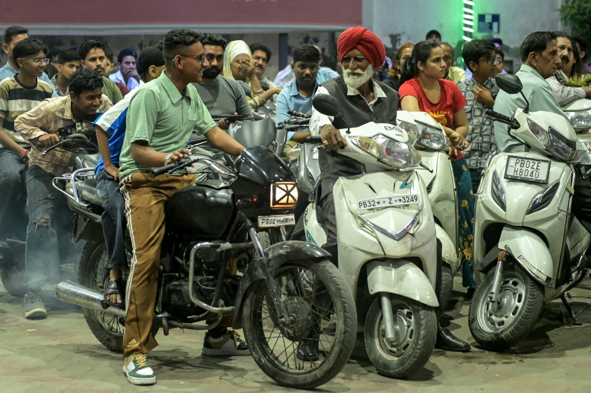 People rush to refuel their vehicles at a fuel station in Amritsar on March 26, 2026 following import disruptions caused by the Middle East conflict. Photo by Narinder NANU / AFP