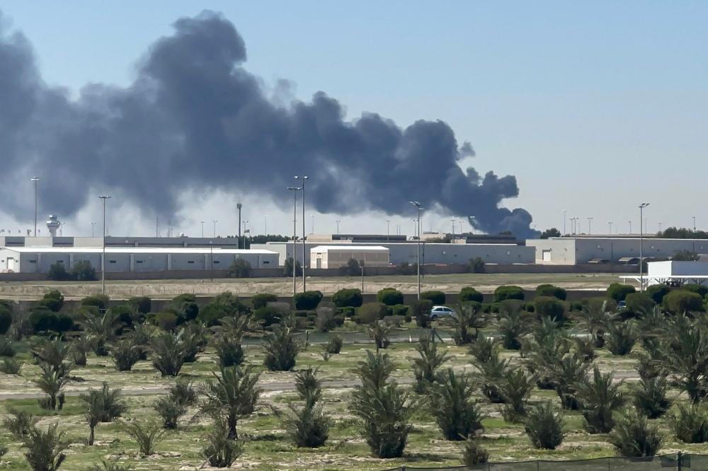 Smoke rises from an area of Kuwait's international airport after a reported drone strike on April 1, 2026. (Photo by AFP) 