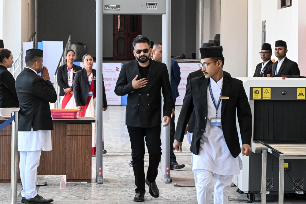 Nepal's Prime Minister Balendra Shah (C) arrives to attend the parliament session in Kathmandu on April 2, 2026.  (Photo by Prakash Mathema / AFP)