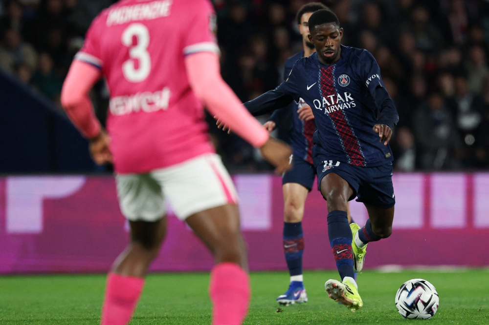 Paris Saint-Germain's French forward #10 Ousmane Dembele kicks the ball during the French L1 football match between Paris Saint-Germain (PSG) and Toulouse FC at the Parc des Princes stadium in Paris on April 3, 2026. (Photo by Anne-Christine Poujoulat / AFP)