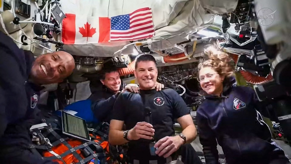 This screengrab taken from a NASA livestream shows Artemis II mission astronauts (L-R) NASA's pilot Victor Glover, NASA commander Reid Wiseman, Canadian Space Agency's mission specialist Jeremy Hansen and NASA's mission specialist Christina Koch as they attend a 