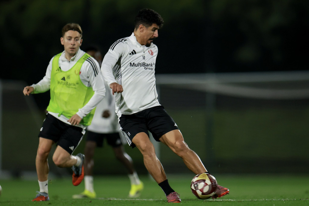Al Shamal’s top scorer in the QSL with eight goals, Baghdad Bounedjah (right), trains with a teammate.