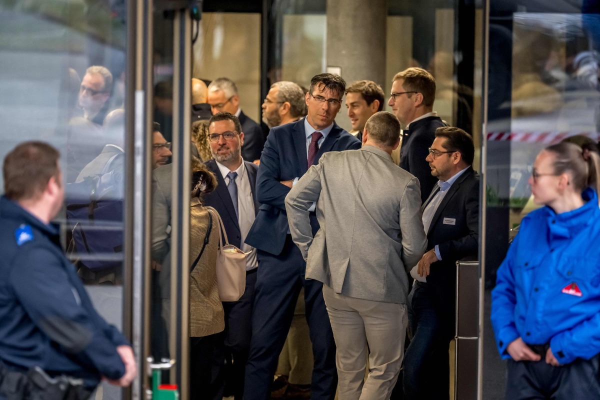 Lawyers wait to enter the room for the hearing of the Mayor of Crans-Montana Nicolas Feraud as part of the investigation over the fire that broke out in the 