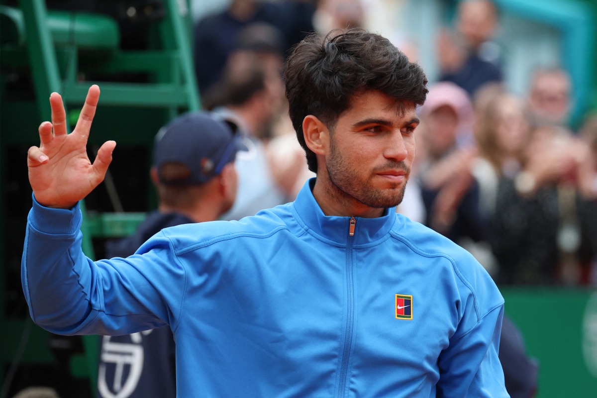 Spain's Carlos Alcaraz gestures after the Monte Carlo ATP Masters Series Tournament final tennis match against Italy's Jannik Sinner on Court Rainier III at the Monte-Carlo Country Club in Roquebrune-Cap-Martin, south-eastern France on April 12, 2026. (Photo by Valery HACHE / AFP)
