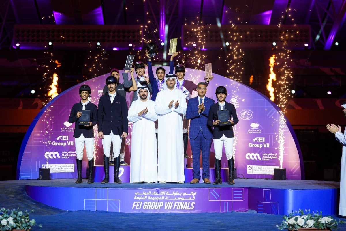 President of Regional Group VII of the International Equestrian Federation Sultan Mohammed Al Yahyai, and Tournament Director Sheikh Talal bin Khalid Al Thani, pose with the podium winners at Al Shaqab. 