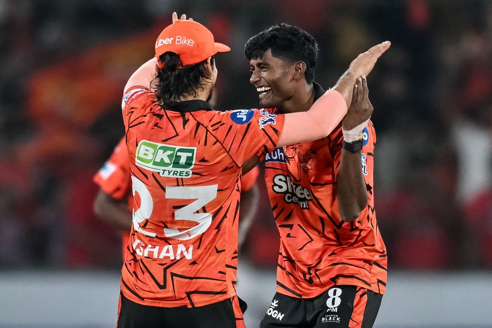 Sunrisers Hyderabad's Indian cricket player Sakib Hussain (R) celebrates with his captain Indian cricket player Ishan Kishan at the Rajiv Gandhi International Stadium in Hyderabad on April 21, 2026. (Photo by Noah Seelam / AFP)
