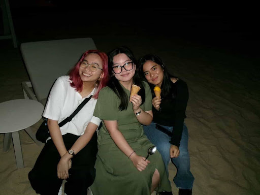 Gwyneth Estomo (GU’27), Lovie Francia (GU-Q’29), and Daphne Soriano (GU-Q’28) during an iftar on March 18, 2026.