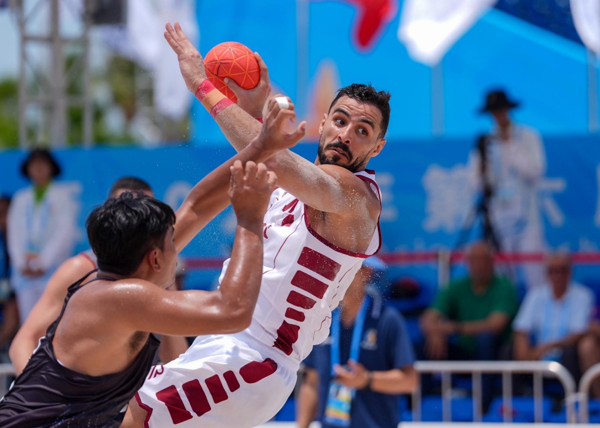 Qatar handball team topped their group after win over Thailand.  
