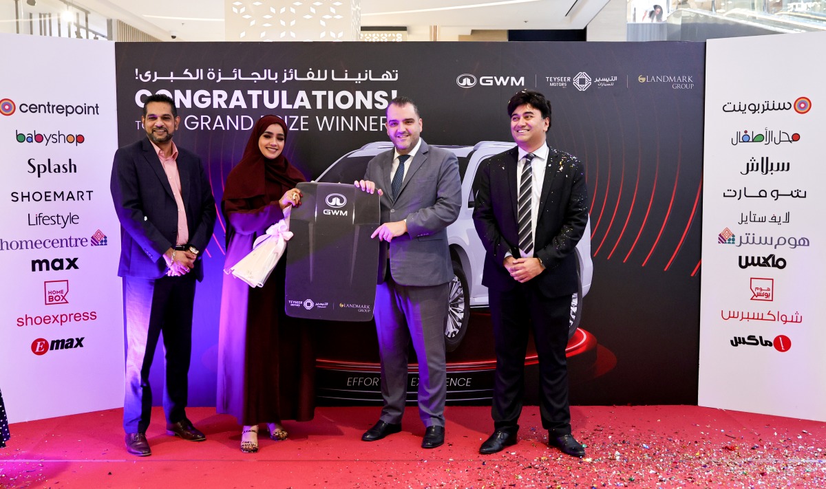 The winner with the officials during the key handover ceremony. Pic: Salim Matramkot