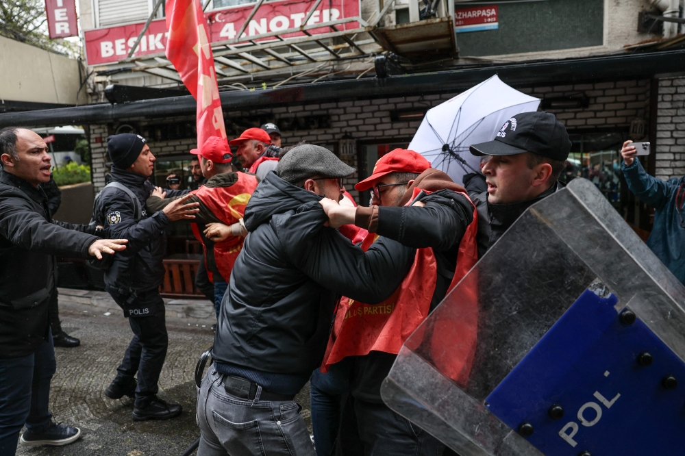 TURKIYE-POLITICS-SOCIAL-LABOUR-MAY DAY-DEMO
Turkish police and protestors scuffle during a May Day (Labour Day) rally, marking international Workers' Day, in Besiktas, a district of Istanbul, on May 1, 2026. 
(Photo by BERK OZKAN / AFP)