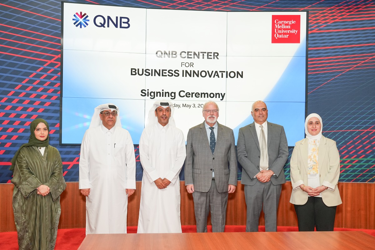 CEO of QNB Group Abdulla Mubarak Al-Khalifa and Dean of CMU-Q Michael Trick with representatives from both institutions during the signing of MoU, yesterday. PIC: MOHAMED ATTAR/THE PENINSULA