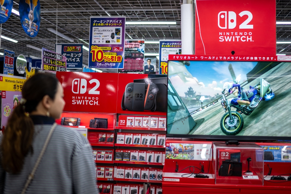 A customer visits the gaming section for Nintendo products at a shop in Tokyo on May 7, 2026. (Photo by Philip Fong / AFP)