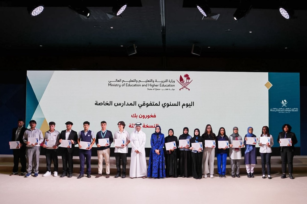 Officials with students during the ceremony. 
