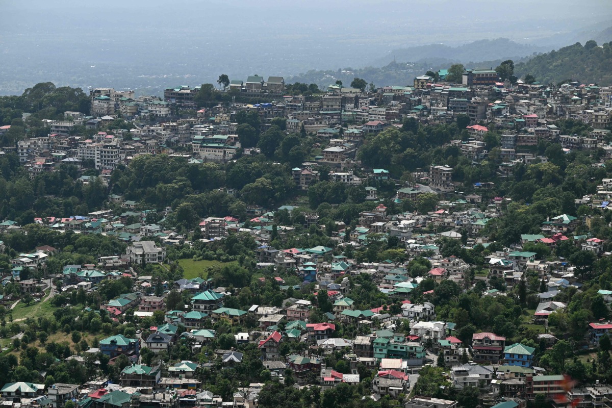 A general view of houses along the hilltop as seen from Indru Nag near Dharamsala on May 15, 2026. (Photo by Sajjad HUSSAIN / AFP)