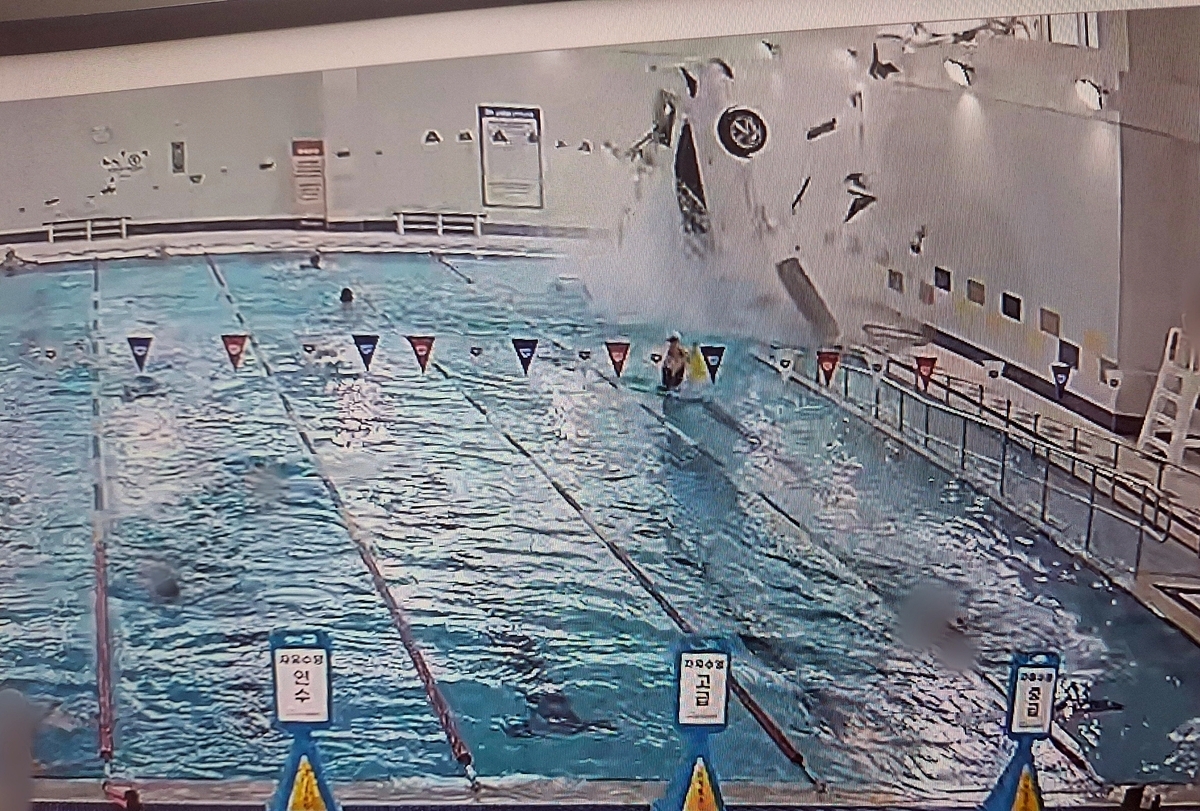 A surveillance camera screenshot shows a car plunging into a swimming pool at a sports center in South Gyeongsang Province on Saturday. Photo credit: Gyeongnam Provincial Police via The Korea Herald