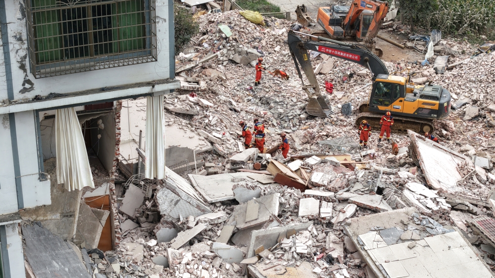 An aerial drone photo shows rescuers carrying out rescue operations after an earthquake in Taiyangcun Community of Taiyangcun Town, Liuzhou, south China's Guangxi Zhuang Autonomous Region. (Photo by Li Hanchi/Xinhua)