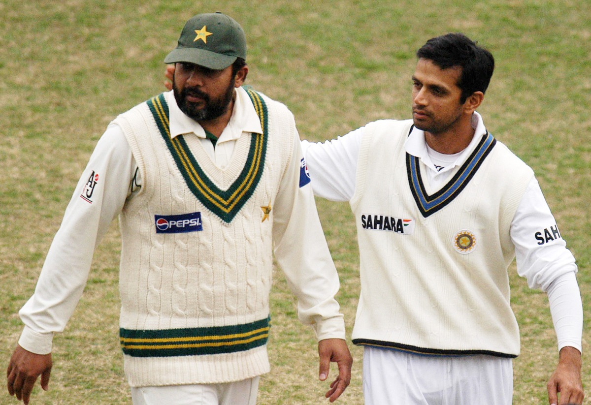 Pakistan's Inzamam-ul-Haq (left) and India's Rahul Dravid leave the ground at close of play on the last day of the first Test match in Lahore, in this January 17, 2006 file photo. AFP