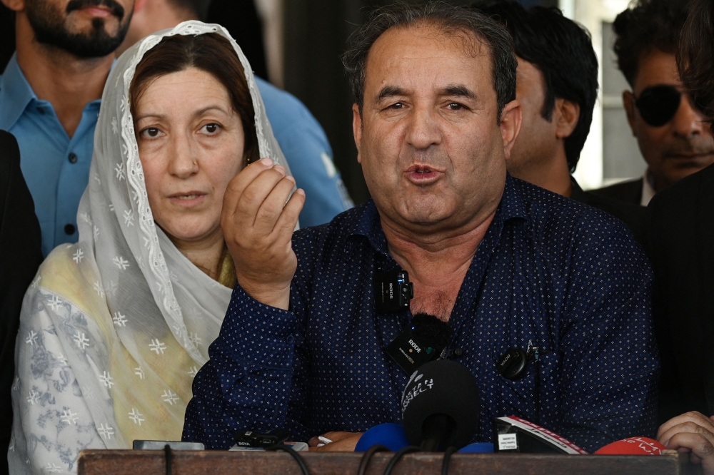 Parents of Pakistani TikTok influencer Sana Yousaf address the media after a verdict outside the court in Islamabad on May 19, 2026. (Photo by Farooq Naeem / AFP)