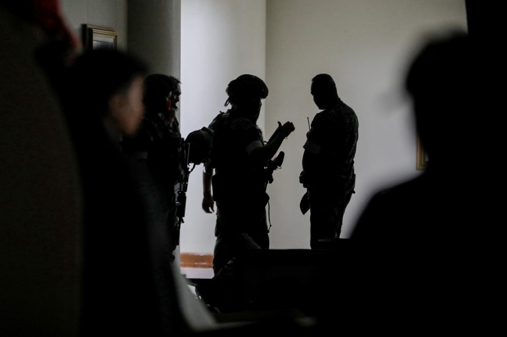Soldiers and security personnel are seen inside the Philippine Senate complex in Pasay City, the Philippines, on May 13, 2026 in an attempted arrest of Senator Ronald Dela Rosa.  (Xinhua)