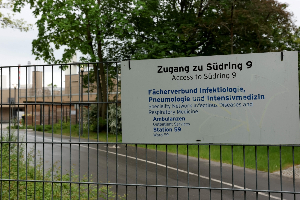 (FILES) A sign indicates the site of a department for infectious diseases and respiratory medicine at the Campus Virchow of the Charite hospital in Berlin on May 11, 2026. (Photo by Odd ANDERSEN / AFP)