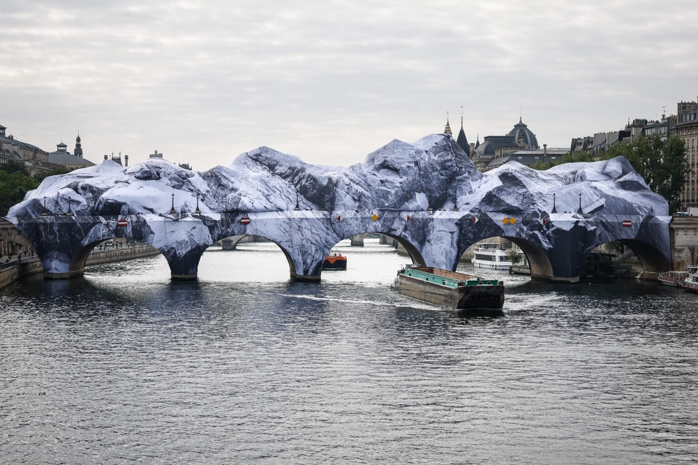 This photograph taken at the Pont-Neuf bridge in Paris on May 21, 2026 shows the installation of 