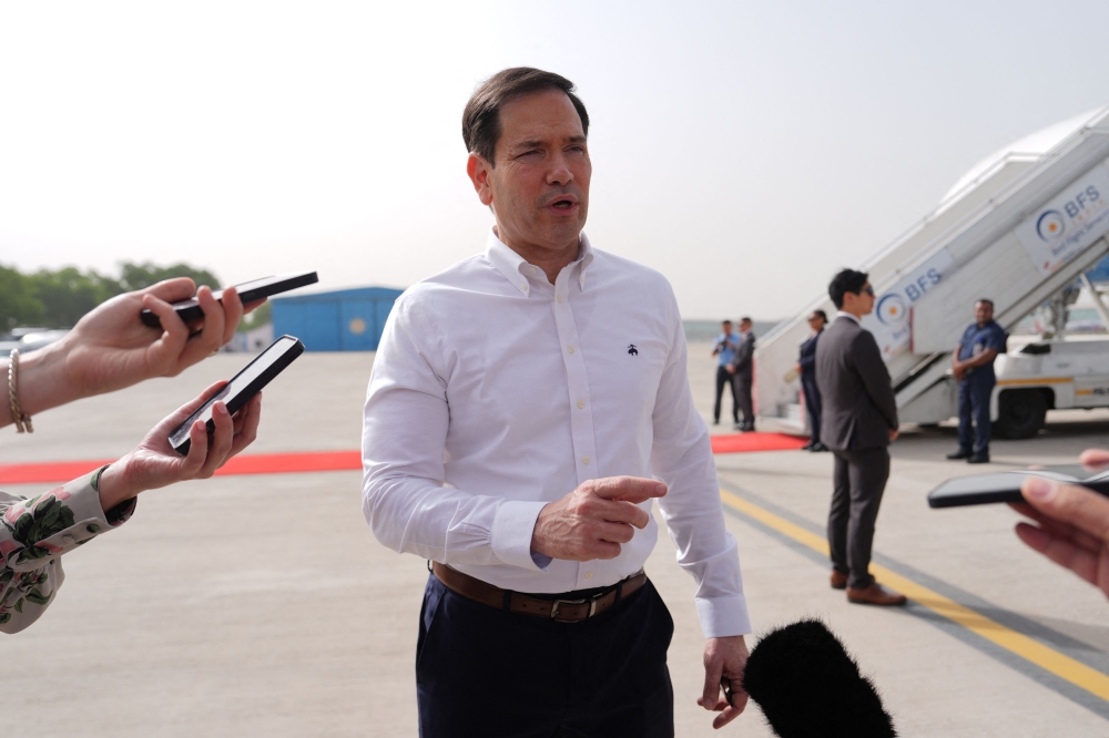 US Secretary of State Marco Rubio speaks to journalists before boarding his plane at Indira Gandhi International Airport in New Delhi on May 25, 2026. (Photo by Julia Demaree Nikhinson / Pool / AFP)
 