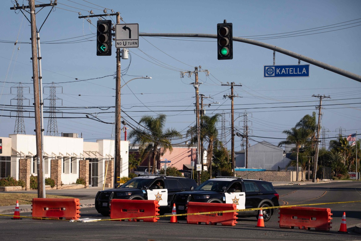Orange County sheriff deputies block Western Avenue at Katella Avenue as roads remain closed after a chemical leak from a large storage tank prompted evacuations in Garden Grove, California, on May 24, 2026. Photo by Blake Fagan / AFP