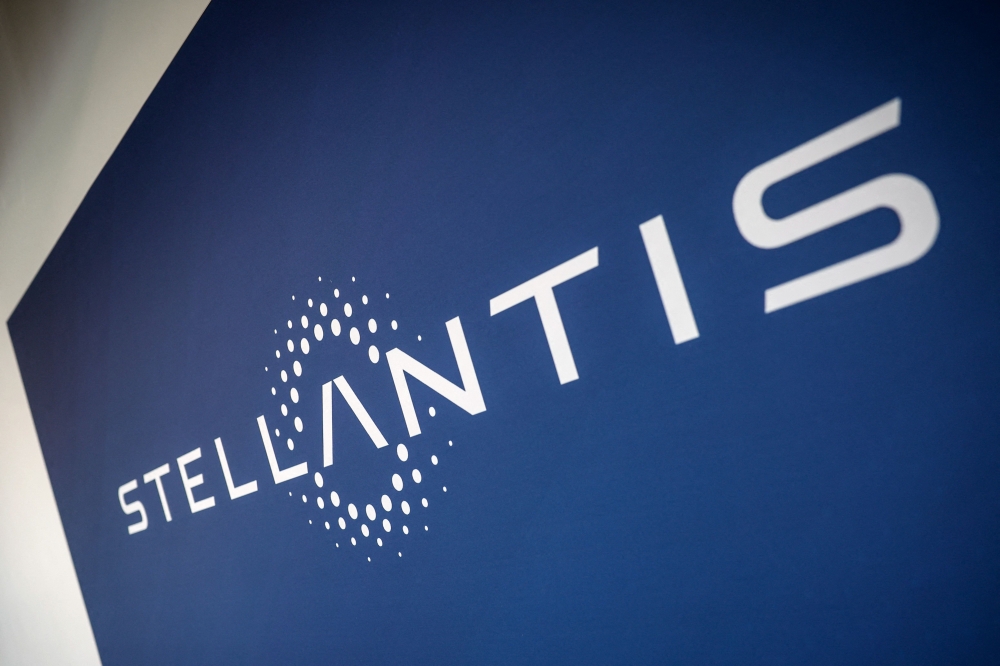 (Files) This photograph shows the Stellantis logo at the Stellantis multinational car manufacturer's plant in Poissy, west of Paris on April 16, 2026. (Photo by Simon Wohlfahrt / AFP)
