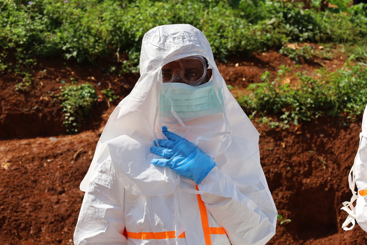 A medical worker puts on protective suits before the burial of an Ebola victim in Mongbwalu, Ituri province, eastern Democratic Republic of the Congo (DRC), May 24, 2026. Photo for representational purposes only. (Str/Xinhua)