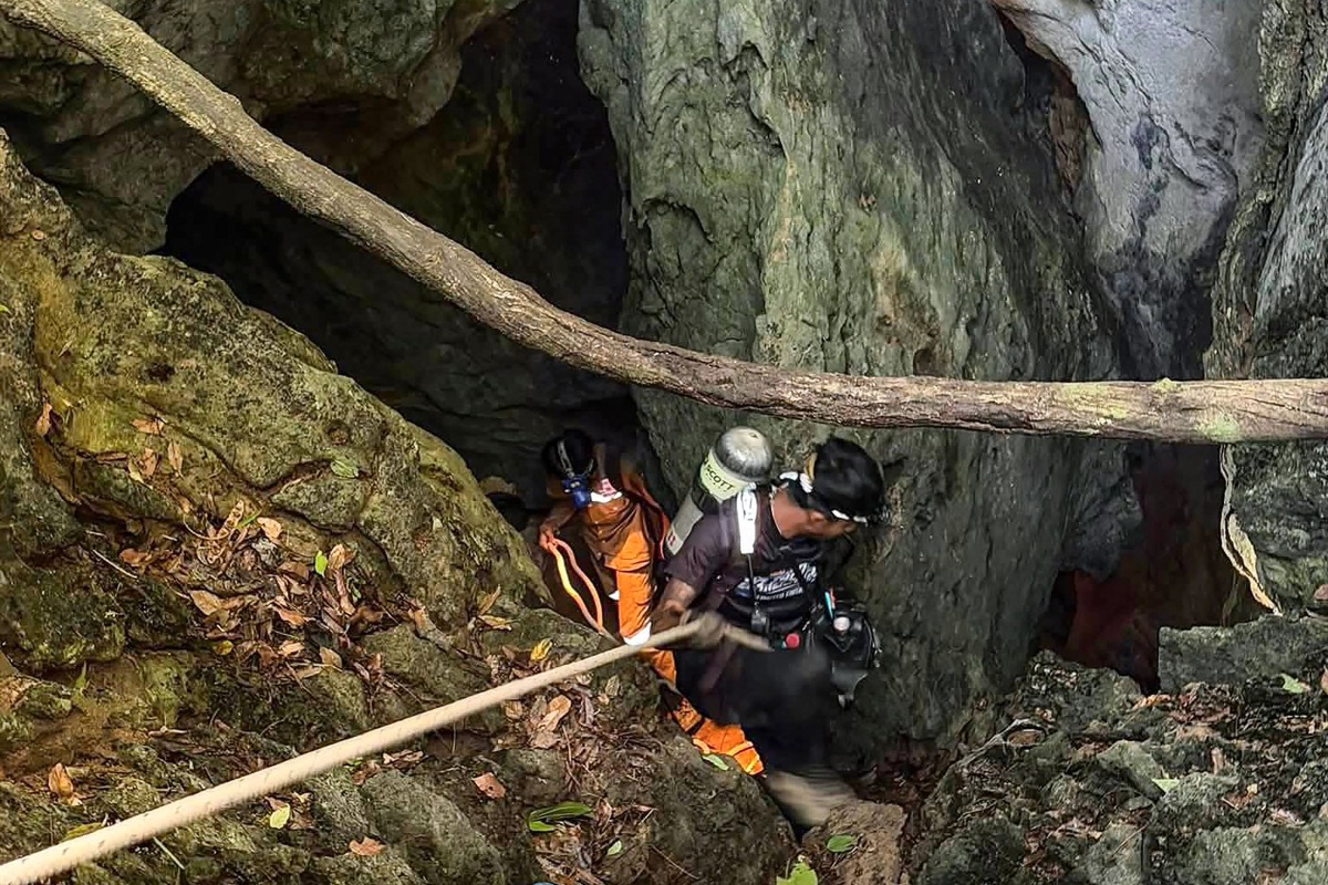 This handout image released by Metta Tham Rescue Kalasin on May 26, 2026 shows rescue workers inside a cave in Xaisomboun province. Photo by Handout / Metta Tham Rescue Kalasin / AFP