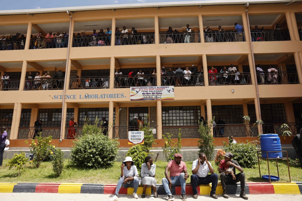Relatives gather and wait for news of their loved ones at the Utumishi Girls Academy following the deadly fire in Gilgil, north of the capital Nairobi on May 28, 2026. (Photo by Simon Maina / AFP)