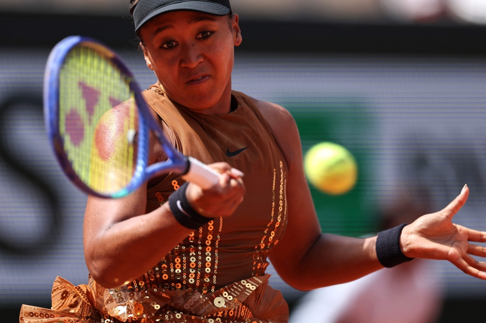 Japan's Naomi Osaka plays a forehand return to US Iva Jovic in Paris on May 30, 2026. (Photo by Anne-Christine Poujoulat / AFP)