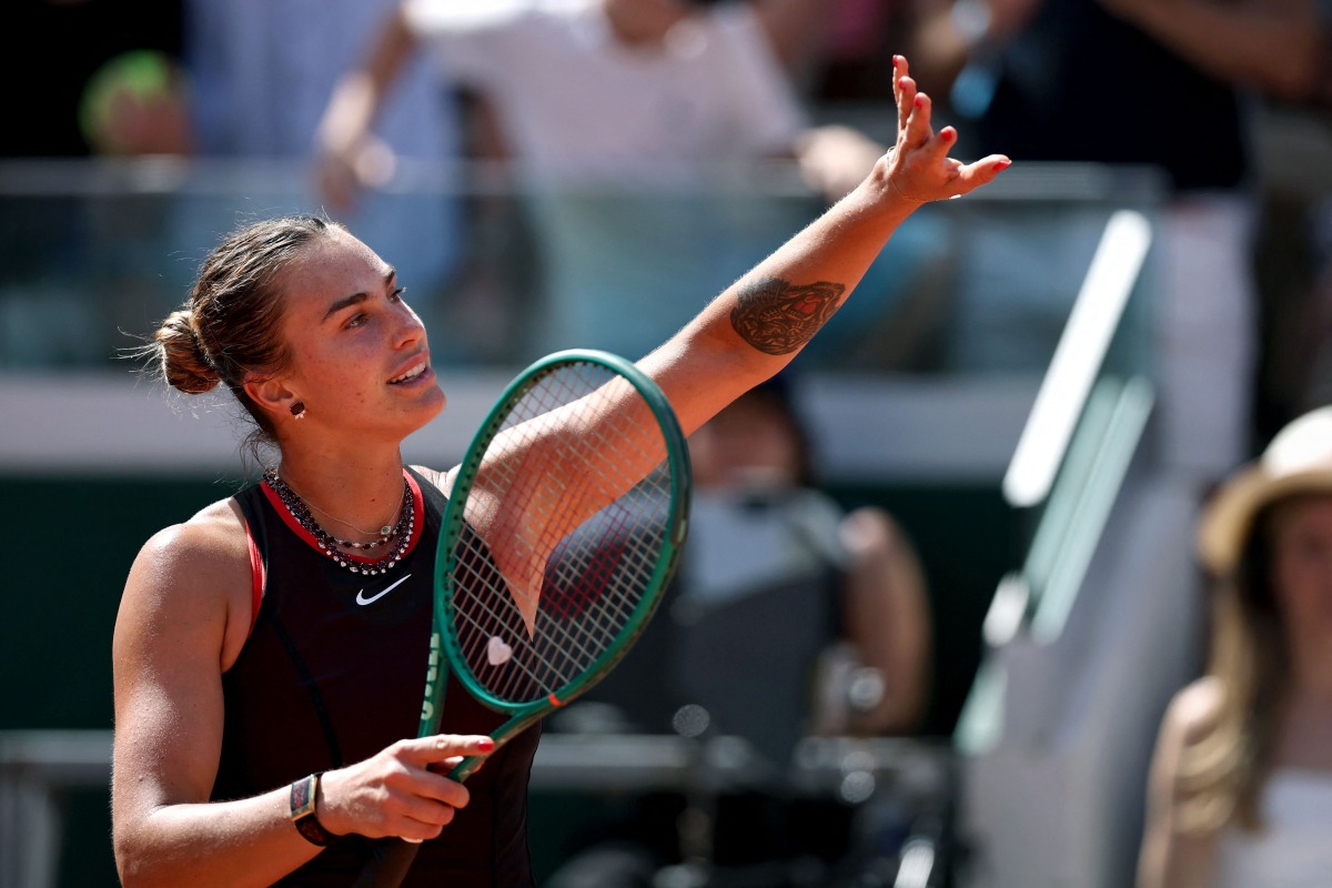 Aryna Sabalenka celebrates her victory at the end of her women's singles match against Australia's Daria Kasatkina on day 7 of the French Open tennis tournament on Court Suzanne-Lenglen at the Roland-Garros Complex in Paris on May 30, 2026. (Photo by Anne-Christine POUJOULAT / AFP)