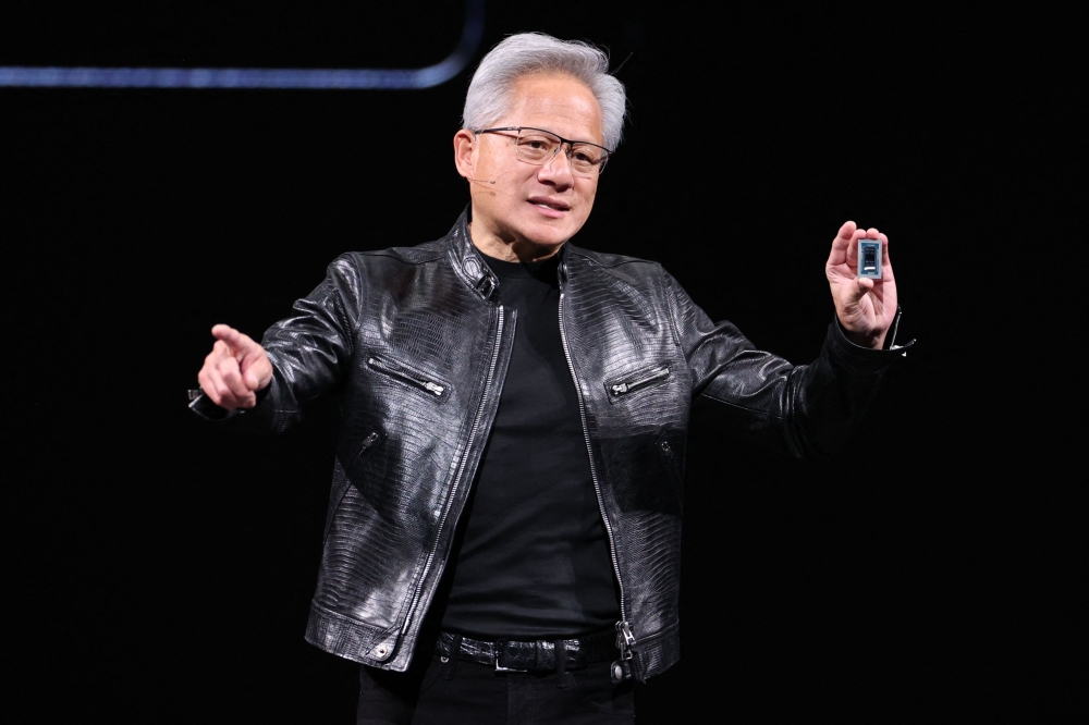 Nvidia CEO Jensen Huang introduces a new chip for Windows laptops during his keynote speech at Computex 2026 in Taipei on June 1, 2026. (Photo by I-HWA CHENG / AFP)