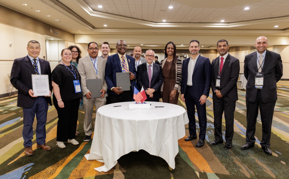 Officials from Qatar Foundation and three US universities at the MoU signing event. 