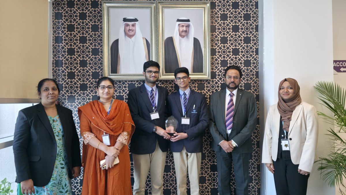 The winning team with the school officials.