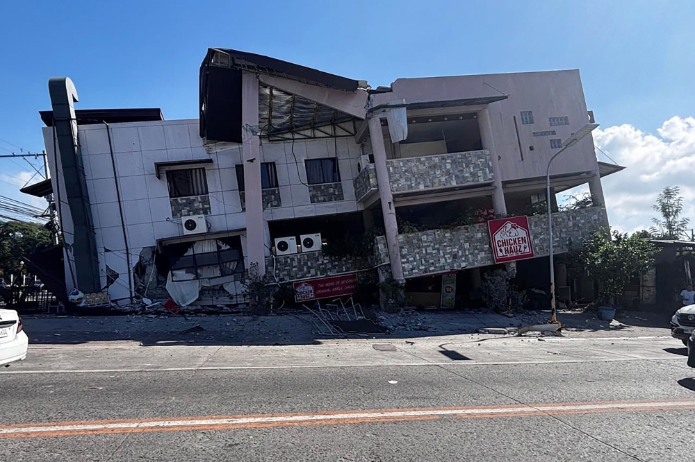 A collapsed building is seen after an 7.8 magnitude earthquake in General Santos City on June 8, 2026. (Photo by Edwin Espejo / AFP)