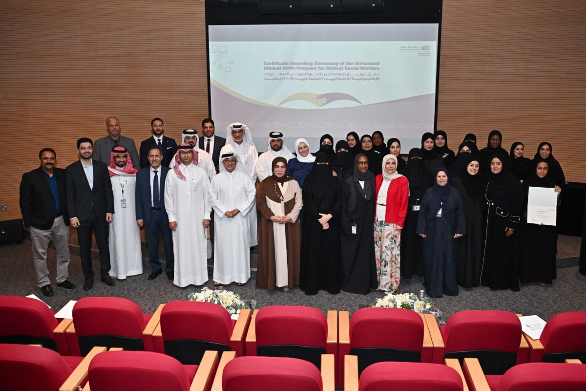 Officials and representatives of partner organisations with the graduates during the event.
