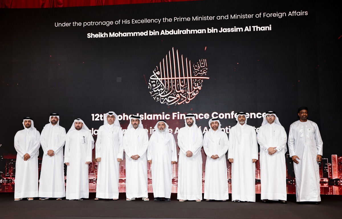 Minister of Endowments (Awqaf) and Islamic Affairs H E Ghanem bin Shaheen bin Ghanem Al Ghanim, Minister of Commerce and Industry H E Sheikh Faisal bin Thani bin Faisal Al Thani, Chairman of the Organizing Committee and Vice Chairman of Bait Al-Mashura Finance Consultations Prof. Dr. Khalid bin  Ibrahim Al-Sulaiti with other dignitaries during the conference yesterday. Pic: Salim Matramkot