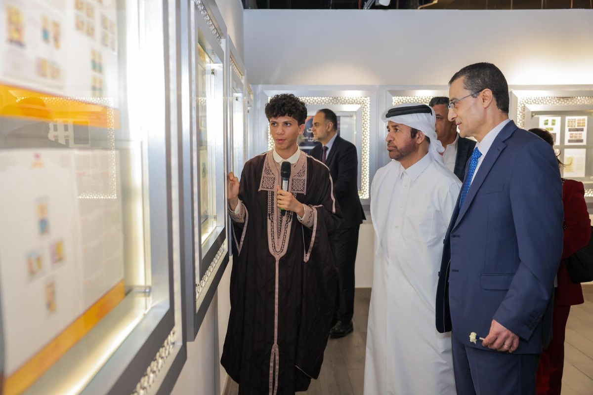 General Manager of Katara Cultural Village Foundation Professor Dr. Khalid bin Ibrahim Al-Sulaiti, Ambassador of the Republic of Tunisia to the State of Qatar H E Farhad Khalif and other officials view the gallery as artist Youssef Ftouhi explains his collection.