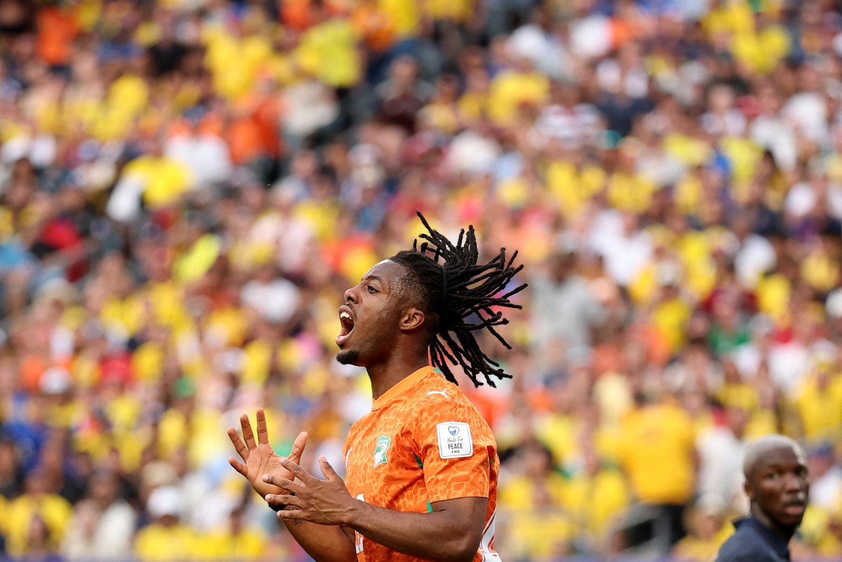 Elye Wahi #12 of Cote d'Ivoire reacts missing a chance during the FIFA World Cup 2026 Group E match between Cote D'Ivoire and Ecuador at Philadelphia Stadium on June 14, 2026 in Philadelphia, Pennsylvania. Darrian Traynor/Getty Images/AFP