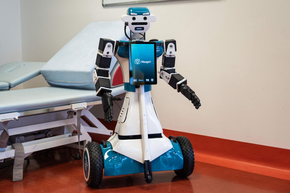 This photograph shows humanoid robot Alter-Ego, designed by the Italian Institute of Technology, at the IRCSS Maugeri hospital in Milan.  (Photo by Marco Bertorello / AFP)