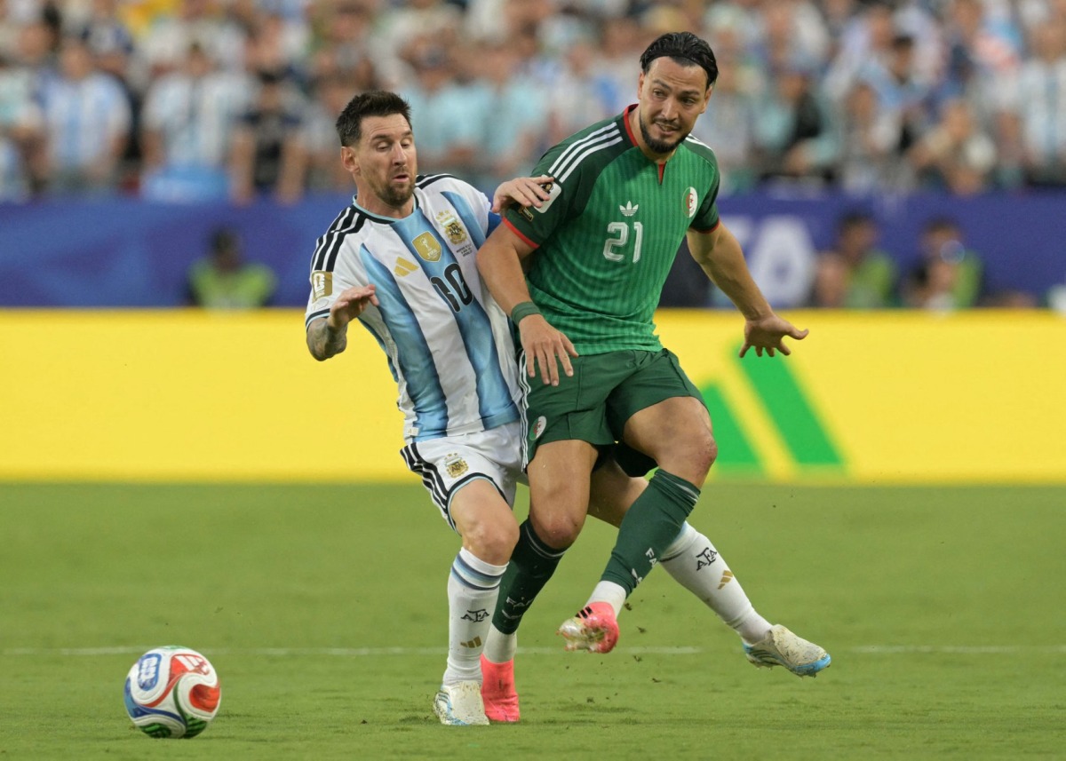 Argentina's forward #10 Lionel Messi and Algeria's defender #21 Ramy Bensebaini during the 2026 World Cup Group J football match between Argentina and Algeria at the Kansas City Stadium in Kansas City on June 16, 2026. (Photo by JUAN MABROMATA / AFP)
