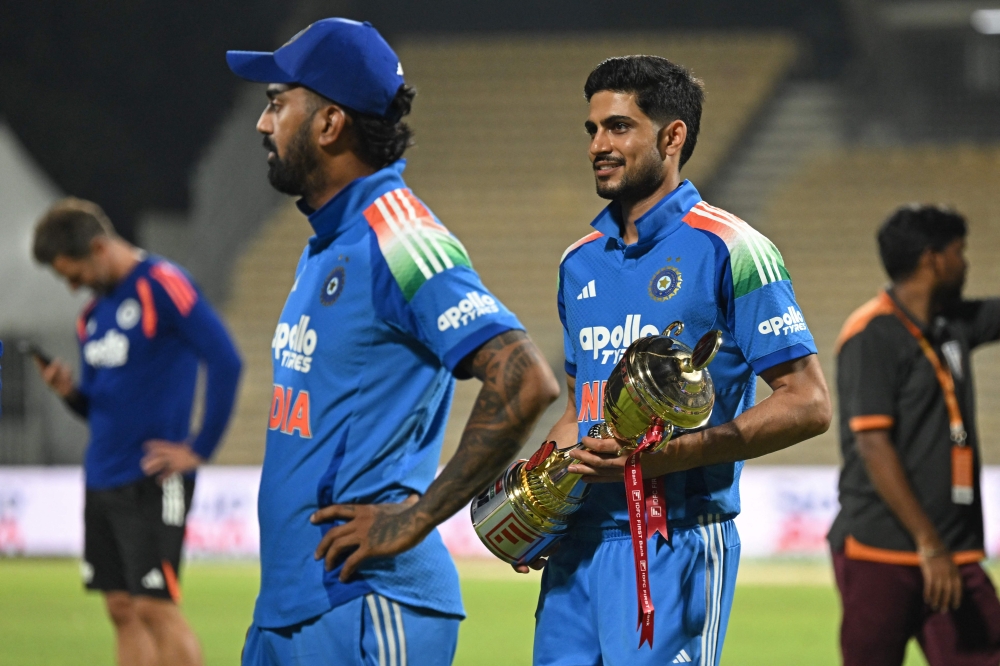 India's captain Shubman Gill holds the series trophy after his team's victory at the end of the third one-day international (ODI) cricket match between India and Afghanistan. (Photo by R. Satish Babu / AFP) 