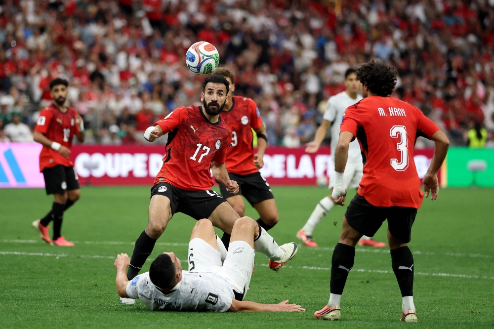 Mohanad Lashin #17 of Egypt competes for the ball against Michael Boxall #5 of New Zealand. Emilee Chinn/Getty Images/AFP